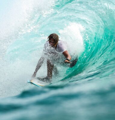Surfer riding a wave, cover for Streaming and Sport