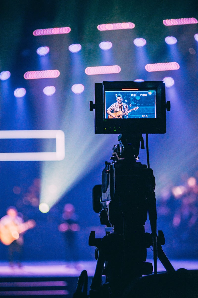 Camera filming a live concert for a livestream
