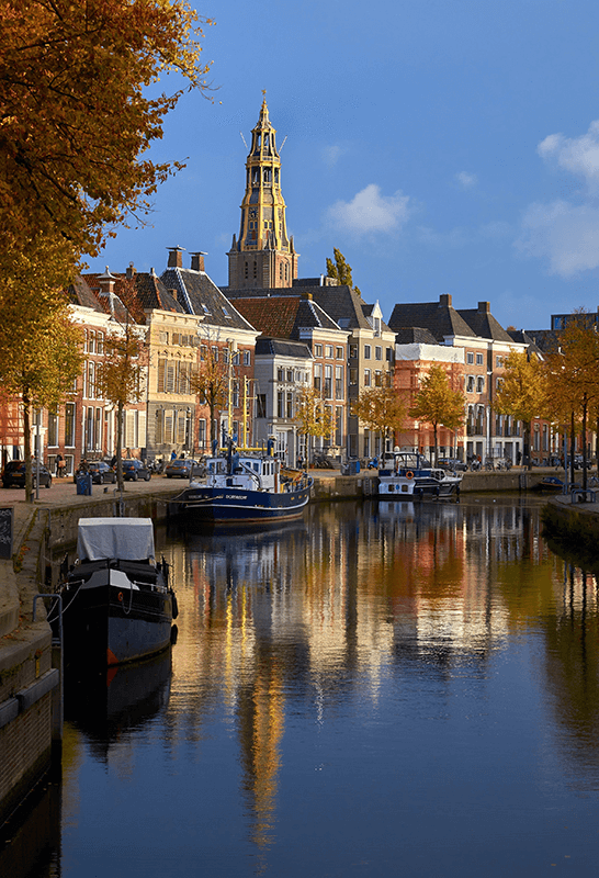 Groningen canal with historic houses and the Martini tower