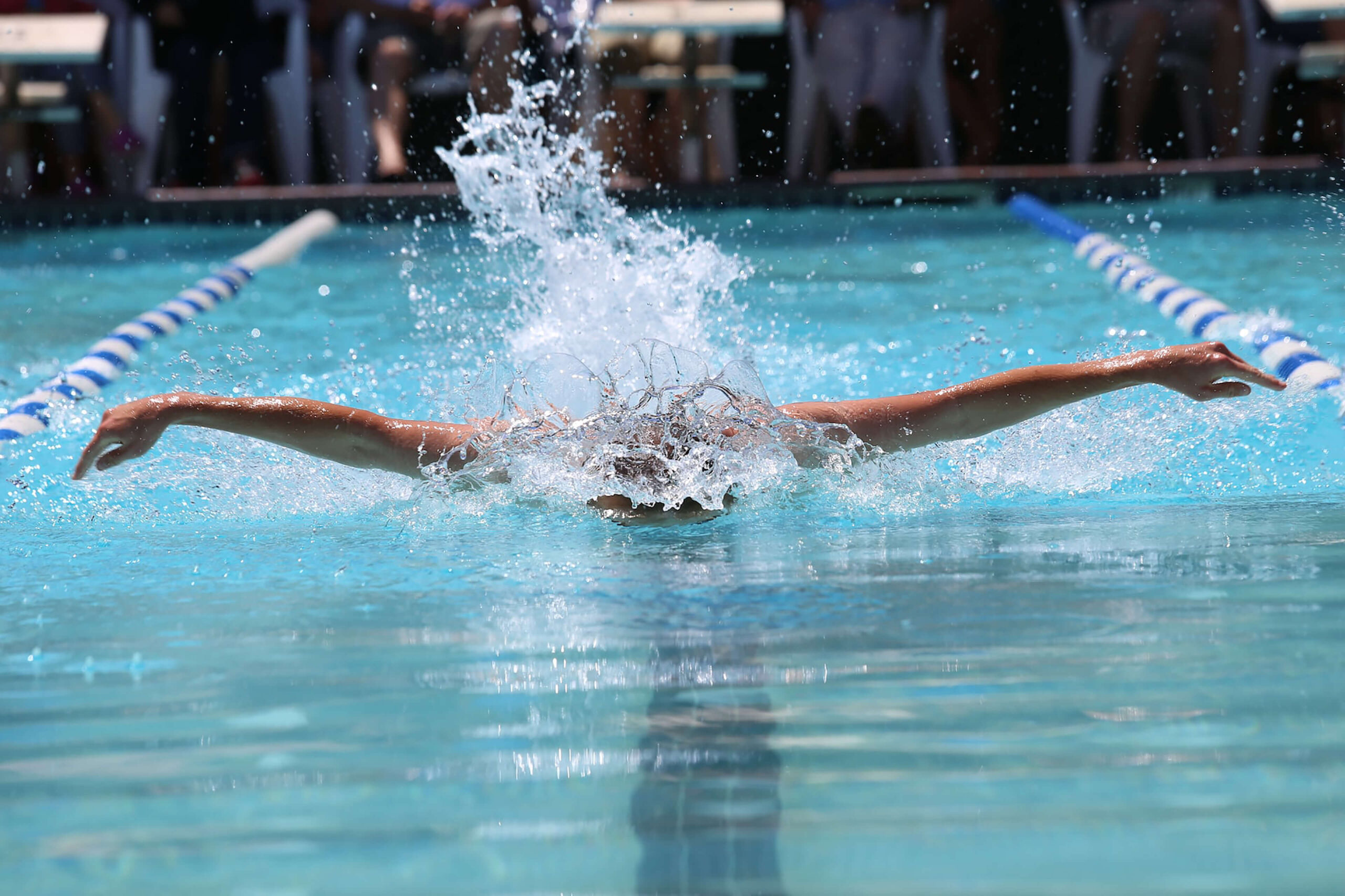 Butterfly swimmer in a pool, illustrating swimming video streaming