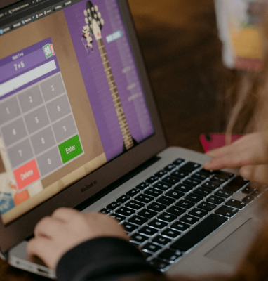Laptop showing an interactive video with clickable buttons