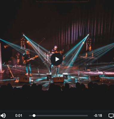 Concert stage with light beams in an HTML5 video player