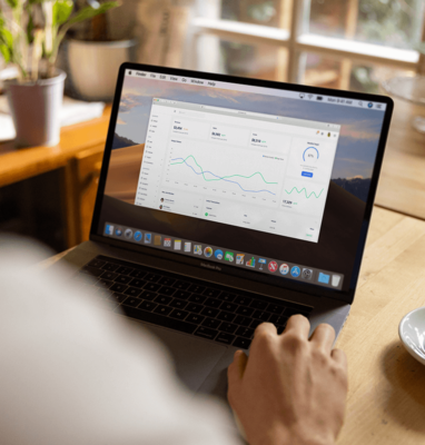 Laptop showing revenue charts, cover for tips for publishers to make money with VOD