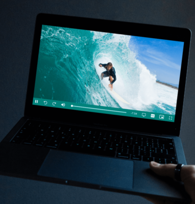 Laptop playing a surfing video in a professional HTML5 video player