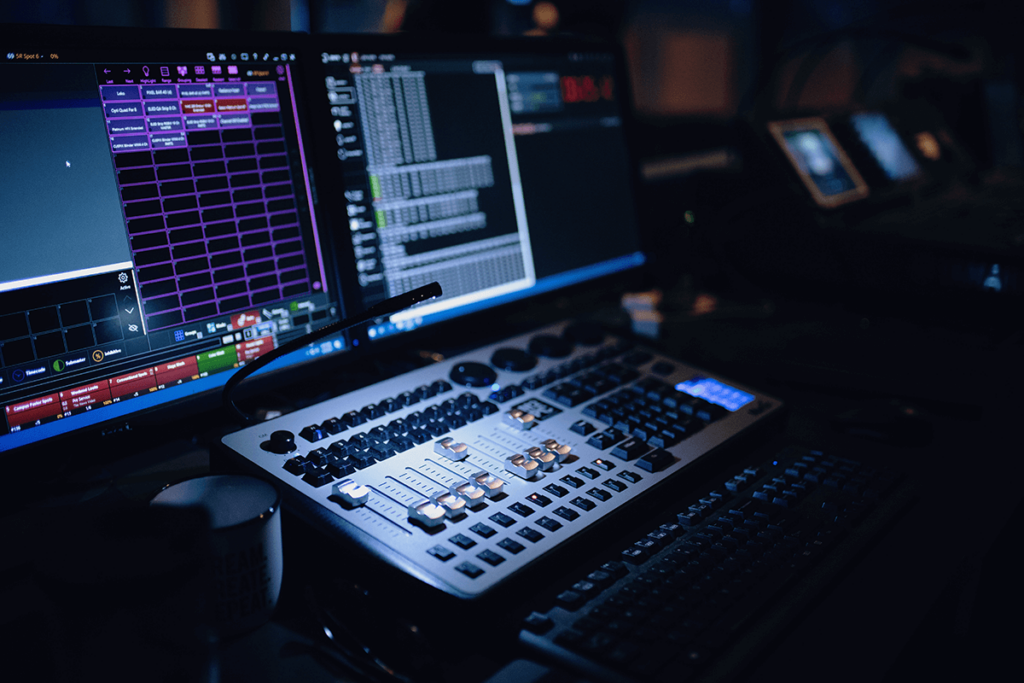 Broadcast control room with mixing desk and monitors for uninterrupted event streaming