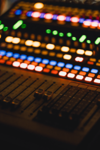 Close-up of an illuminated audio mixing console