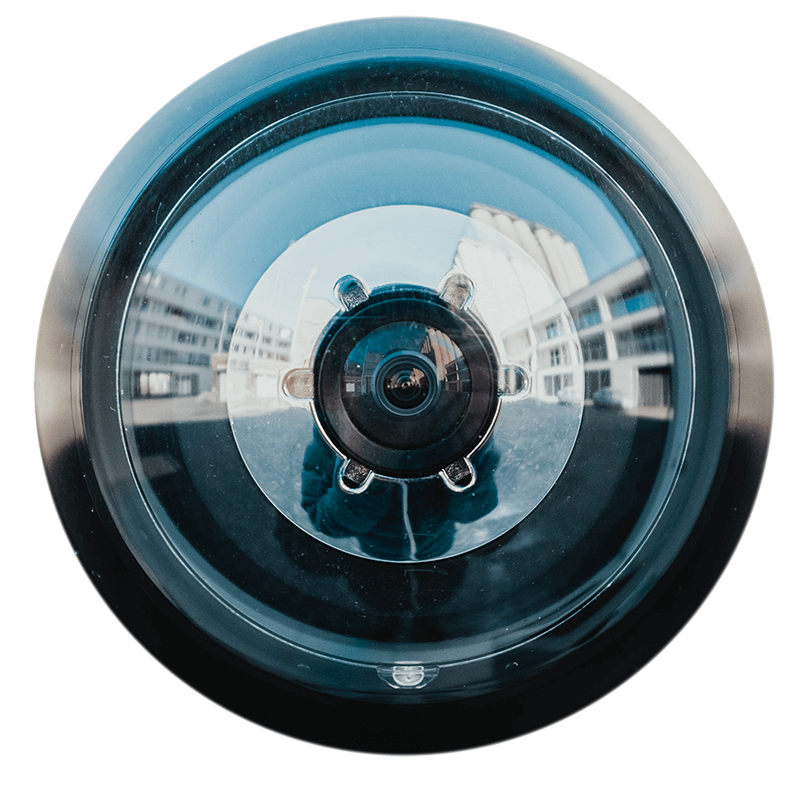 Camera lens reflecting buildings, symbolising high video quality for live events