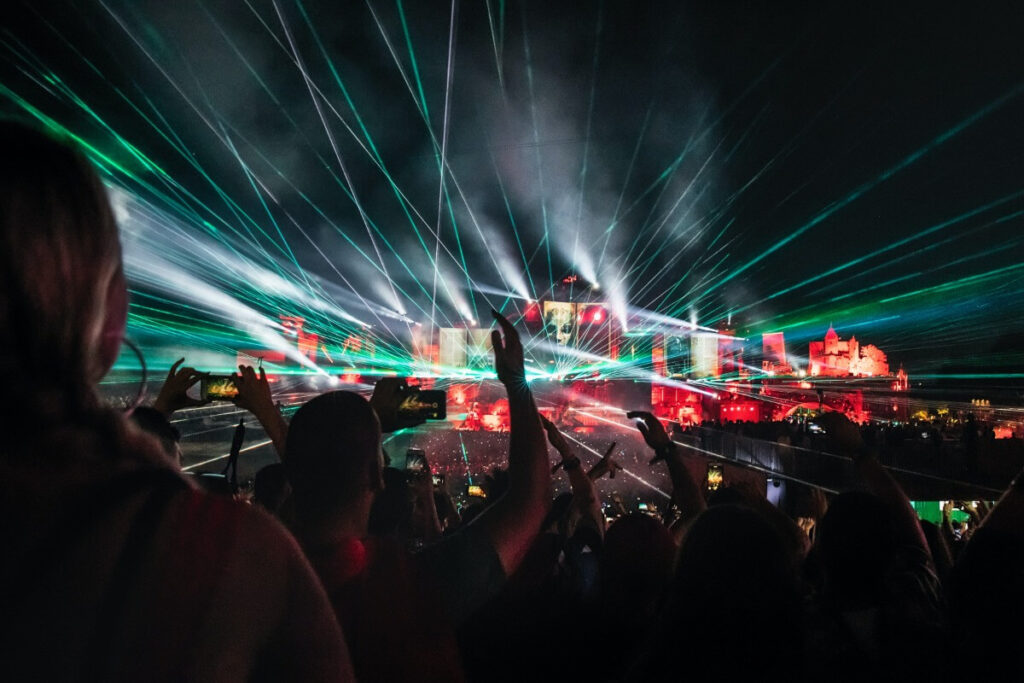 Concert crowd with laser lights, illustrating high-quality video delivery via your cloud or CDN