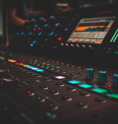 Audio mixing console with colored lights, illustrating encoding and packaging benchmarks