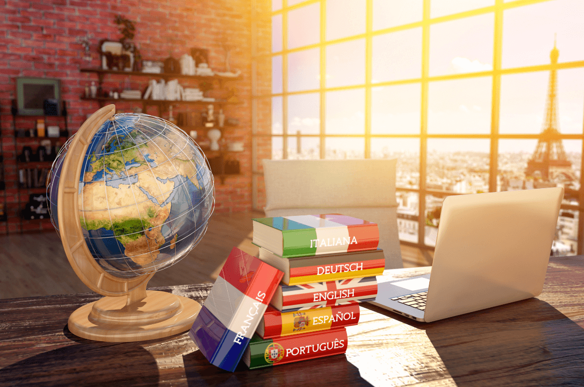 Globe and books with flags in a sunlit room, illustrating multi-language streaming