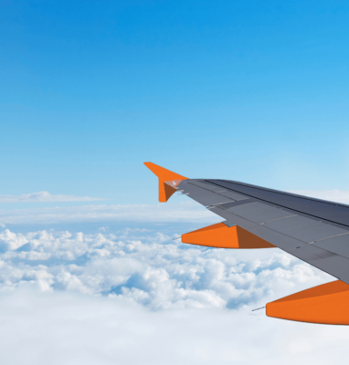 Airplane wing above the clouds, cover for The Broadcast Mindset versus the Internet Mindset